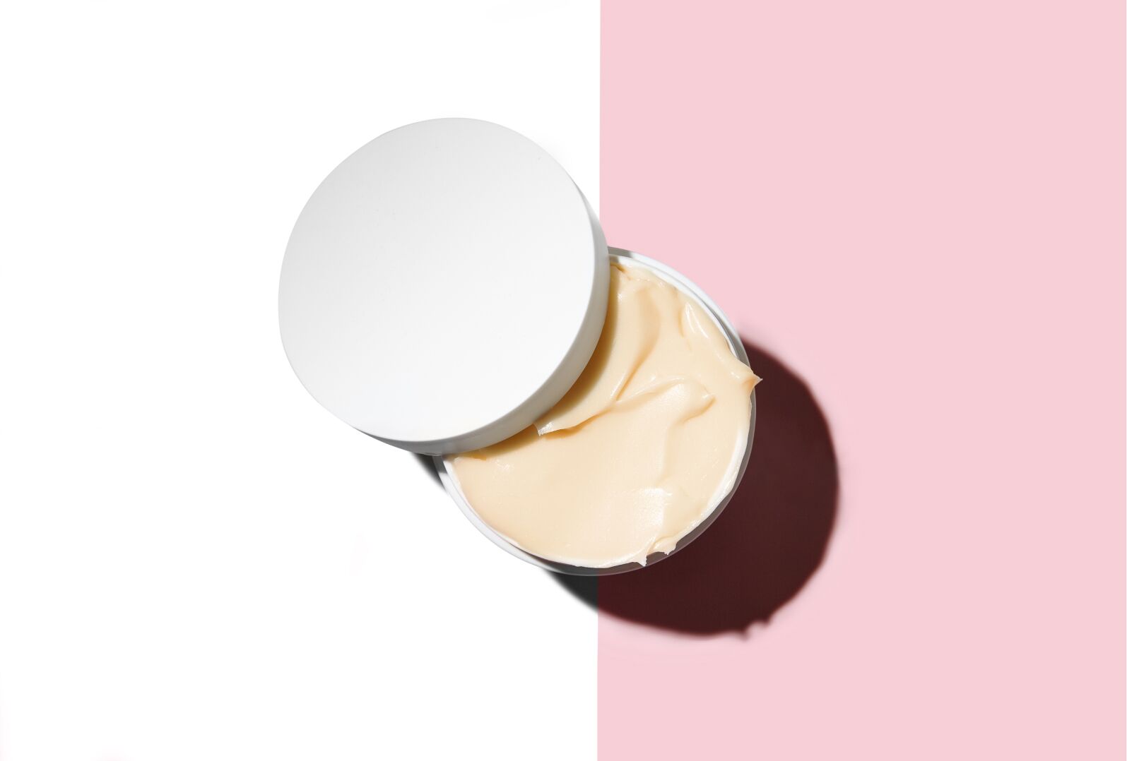 general-product-image.jpg A Beauty Pie Moisturiser with a pink and white background